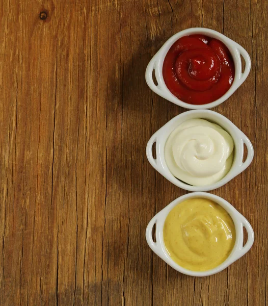 Mustard, ketchup and mayonnaise - three kinds of sauces — Stock Photo, Image