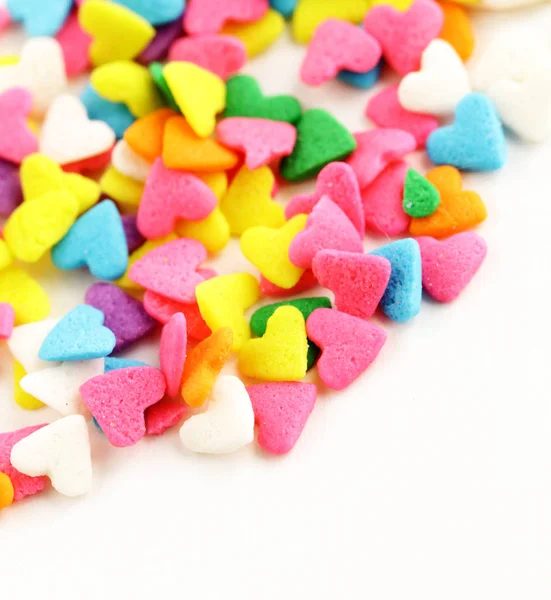 Kleurrijke snoepjes in de vorm van harten — Stockfoto