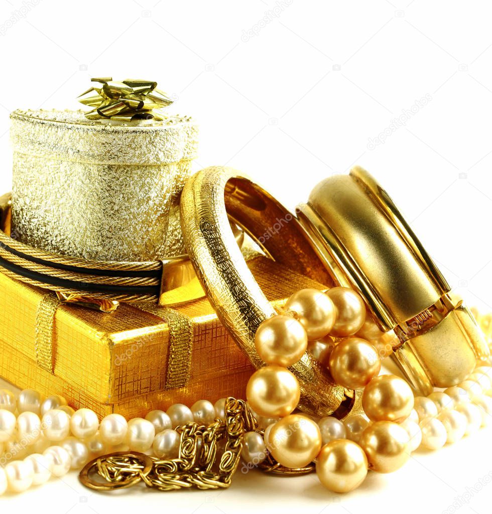 Gold jewelry, bracelets and chains. Luxury accessories.