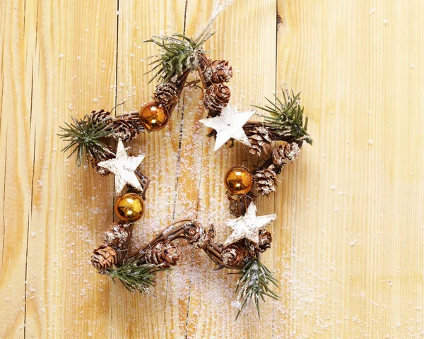 Christmas symbols and decorations on wooden background — Stock Photo, Image