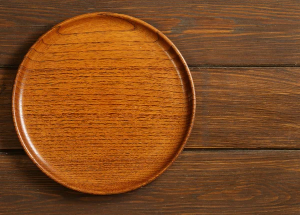 Empty wooden plate — Stock Photo, Image