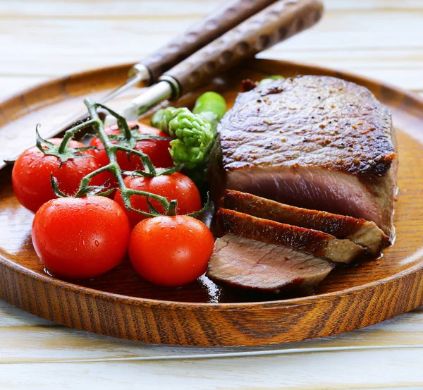Roasted beef steak with vegetables and spices — Stock Photo, Image