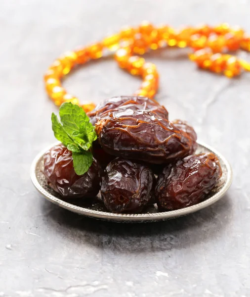 Sweet dried figs dates in a plate on the table — Stock Photo, Image