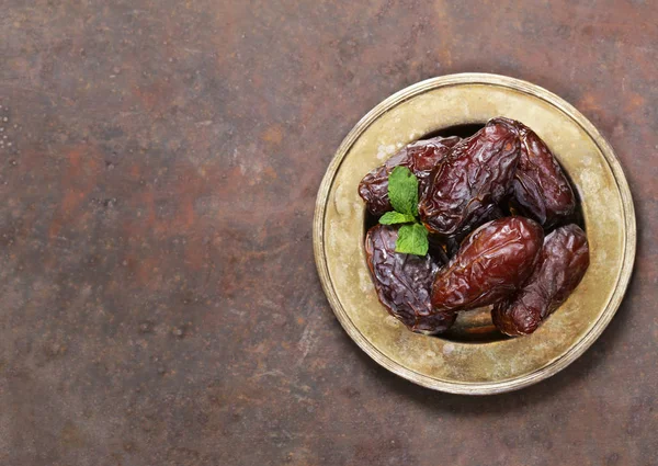 Sweet dried figs dates in a plate on the table — Stock Photo, Image