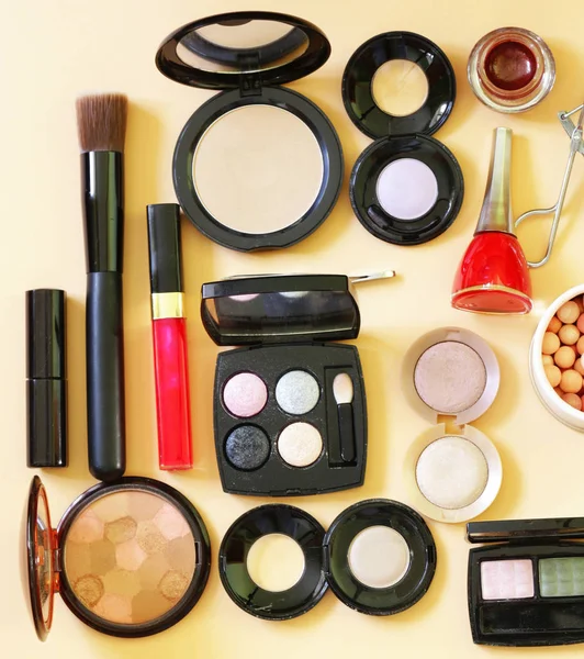 Set cosmetics - makeup brushes, eye shadow, powder, lipstick, nail polish