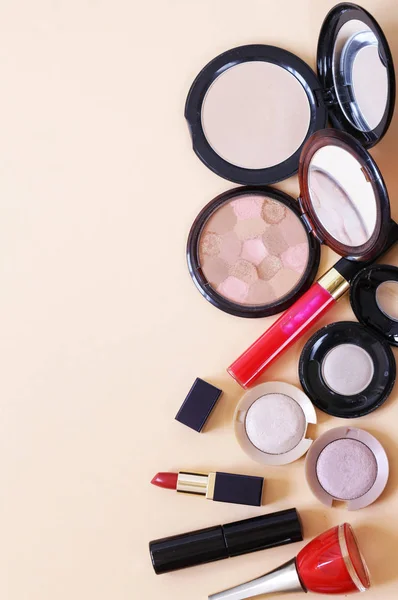 Set cosmetics - makeup brushes, eye shadow, powder, lipstick, nail polish