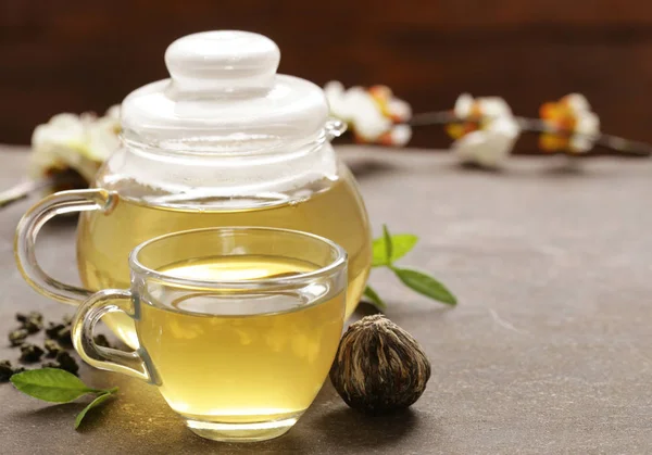 Traditional green tea in a kettle on the table — Stock Photo, Image