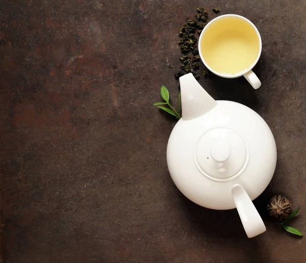 Traditional green tea in a kettle on the table — Stock Photo, Image