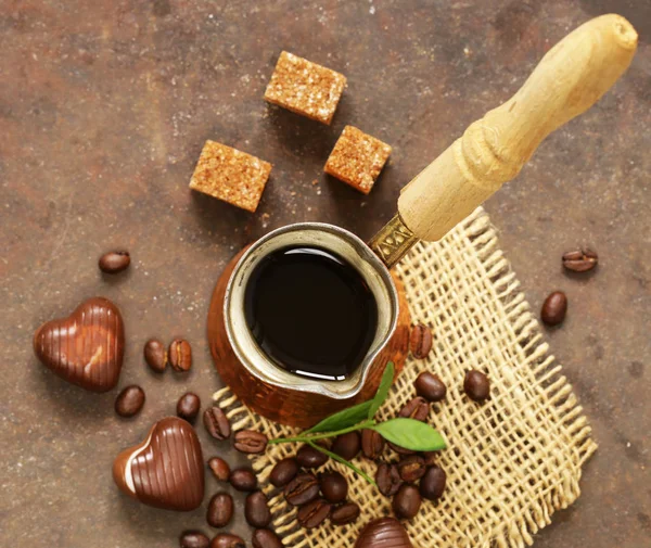 Copper cezve coffee and grains on a steel background — Stock Photo, Image