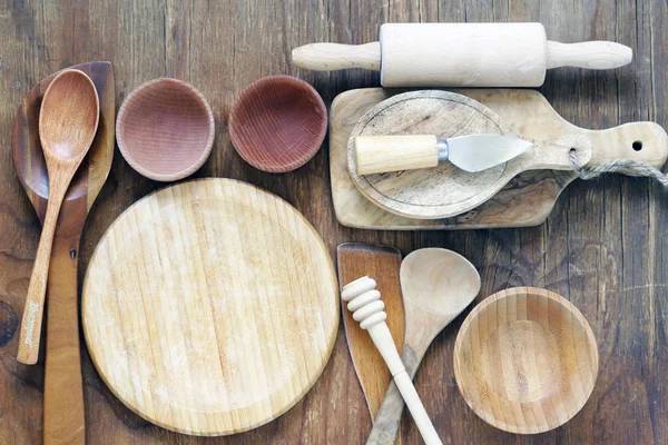 Empty wooden utensils on the table, rustic style — Stock Photo, Image