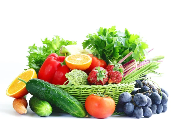 Organic fruits and vegetables in a basket on a white background — Stock Photo, Image