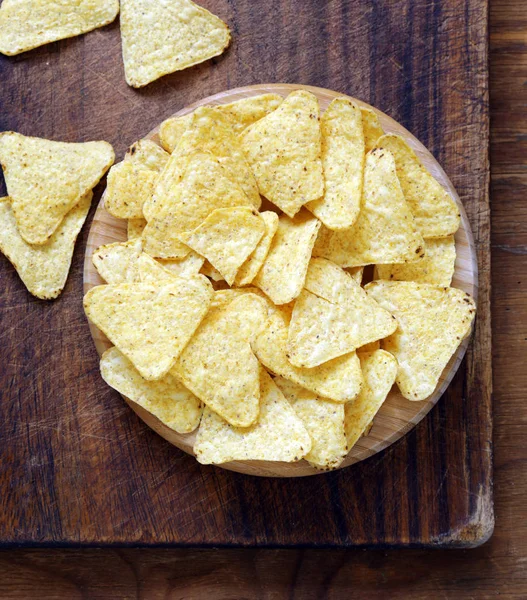 Corn chips nachos on a wooden plate — Stock Photo, Image