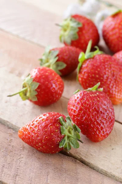 Ripe organic berry strawberry on a wooden table — Stock Photo, Image