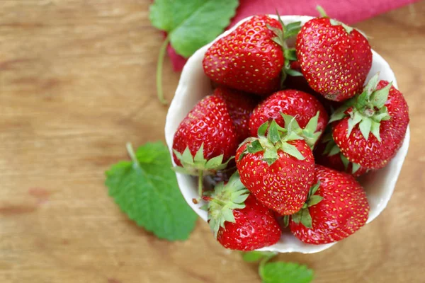 Ripe organic berry strawberry on a wooden table — Stock Photo, Image