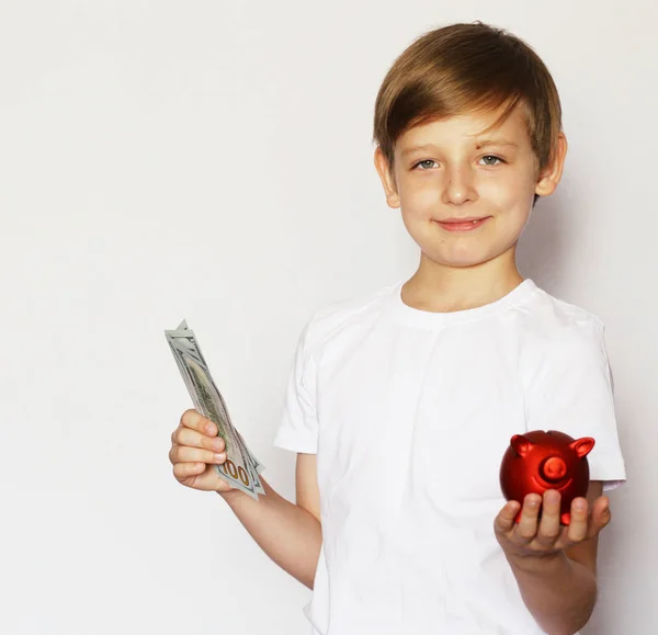Blond boy with a red pig piggy bank — Stock Photo, Image