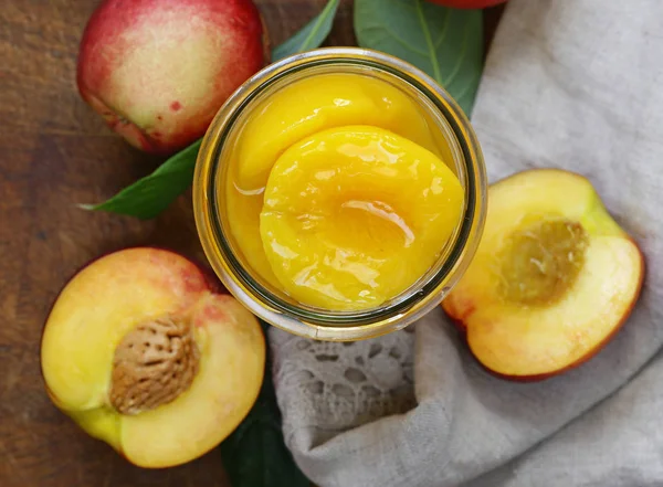 Organic fruits, ripe sweet canned peaches