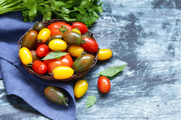 Ripe organic tomatoes in a wicker basket