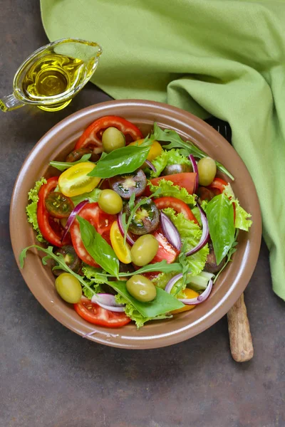 Mediterranean salad with olives, avocado and tomatoes