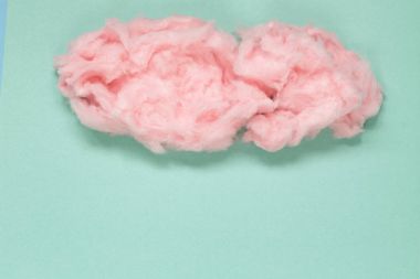 Tatlı pembe pamuk şeker renkli bir arka plan üzerinde