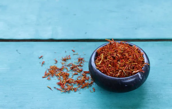 Traditional aromatic spice saffron in a mortar — Stock Photo, Image