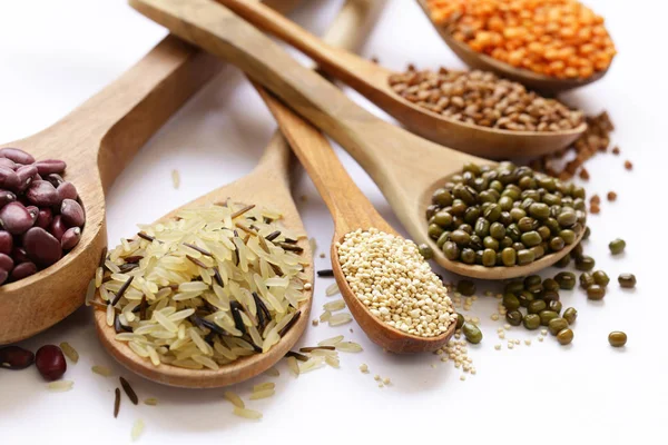 different cereals - beans, lentils, rice on a white background