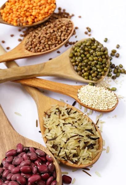 different cereals - beans, lentils, rice on a white background