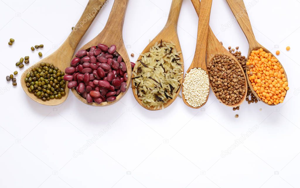 different cereals - beans, lentils, rice on a white background