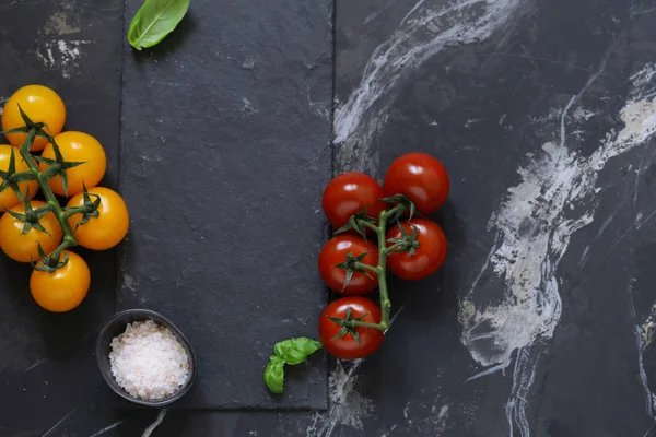 background for food menu, black graphite and tomatoes