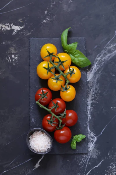 background for food menu, black graphite and tomatoes