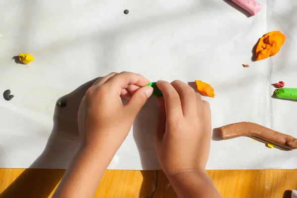 Child hands with plasticine in home at Thailand. — Stock Photo, Image