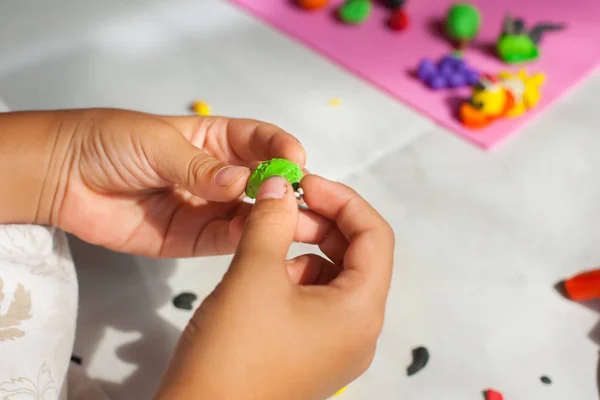 Child hands with plasticine in home at Thailand. — Stock Photo, Image