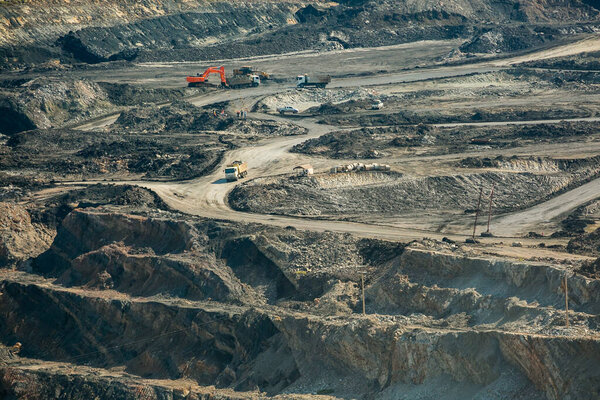 Mining dump trucks working in coalmine , Used as a source of electricity generation in the country.