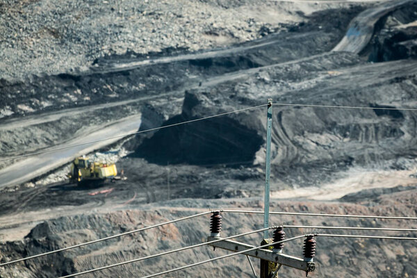 Mining dump trucks working in coalmine , Used as a source of electricity generation in the country.