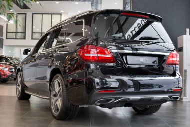 Russia, Izhevsk - February 20, 2020: New modern GLS 350d car in the Mercedes-Benz showroom. Side and back view. Famous world brand.