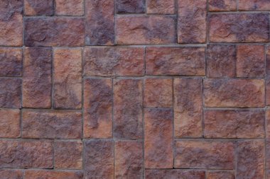 Taş yapının altındaki duvar kiremitleri. Kum taşı. Arkaplan olarak taş duvar kullanımı.