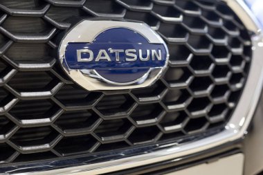 Russia, Izhevsk - March 19, 2020: Logo of Datsun car on display in the dealer showroom. Famous world brand. clipart