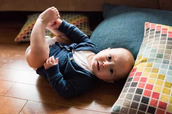 Cute Baby Boy Laying Floor Playing Feet While Wearing White — Stock Photo, Image