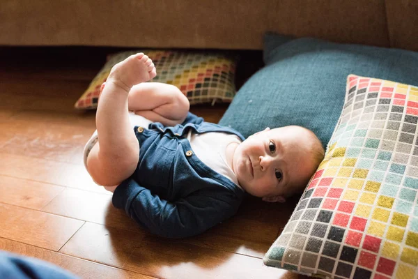 Cute Baby Boy Laying Floor Playing Feet While Wearing White — Stock Photo, Image