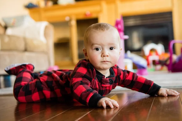 Baby Boy Red Sleeper Lays His Belly Floor — Stock Photo, Image