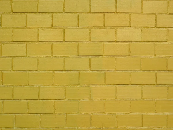 Muro de ladrillo pintado en color dorado — Foto de Stock