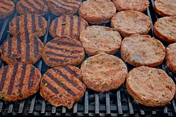 Meat cutlets fried on iron bars — Stock Photo, Image