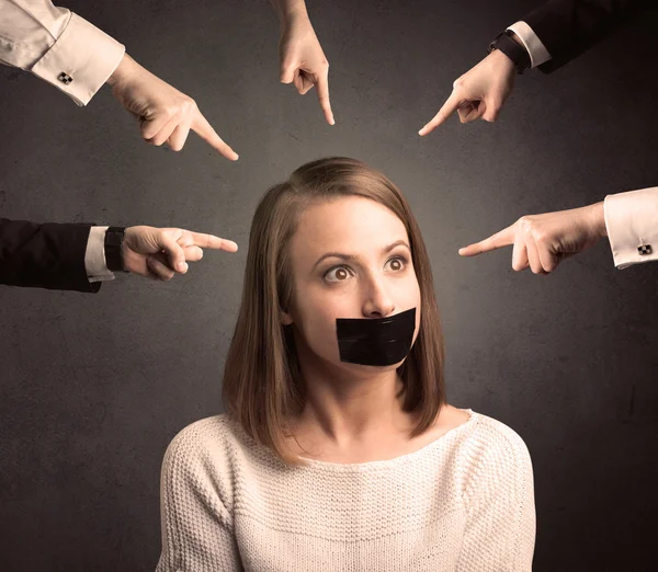 Multiple hands pointing at woman — Stock Photo, Image