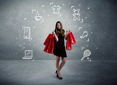 Çantalar ve çizilmiş simgelerle alışveriş yapan kadınlar.