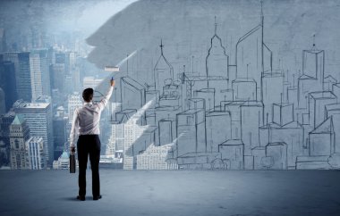 Zarif satıcı şehri duvarda yeniden boyuyor.