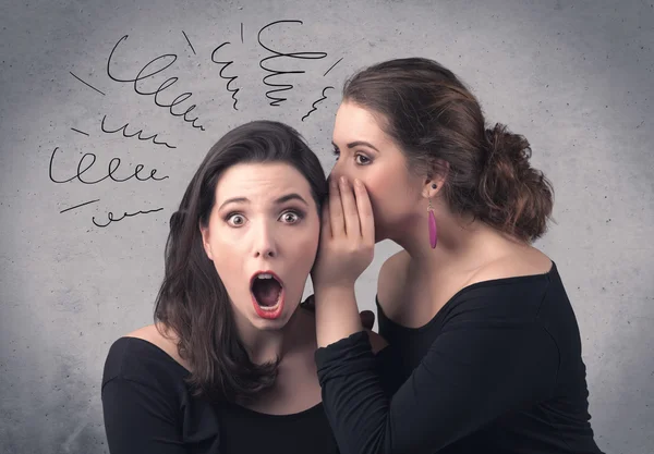 Girl telling secret things to her girlfriend — Stock Photo, Image