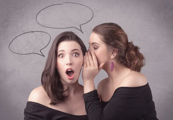 Girl telling secret things to her girlfriend — Stock Photo, Image