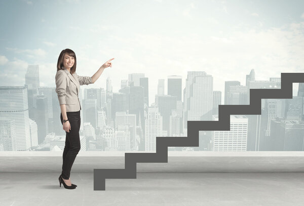 Business person in front of a staircase