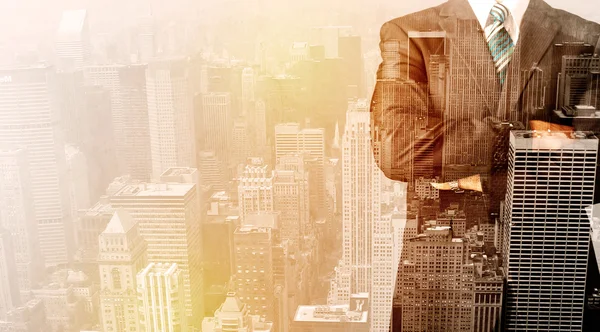 Business man looking at overlay city background — Stock Photo, Image