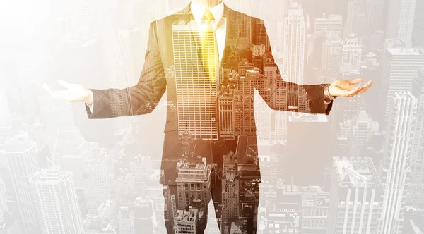 Business person with warm color overlay of city background — Stock Photo, Image