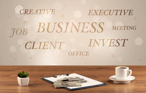 Business office desk with writing on wall — Stock Photo, Image